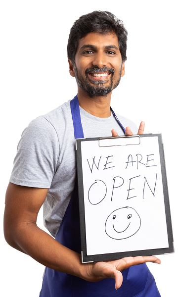 Man holding we are open sign, new business owner